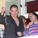 Channing Tatum throwing beads off balcony of his restaurant during VIP 'Touchdown on Bourbon St' Super Bowl party in New Orleans
