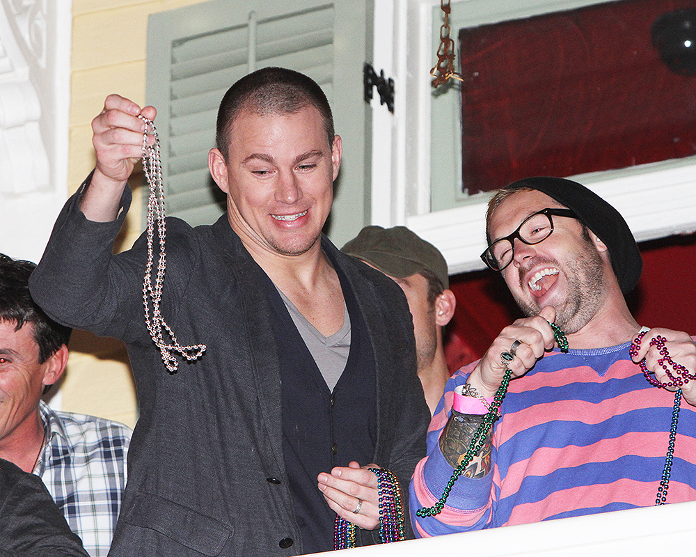 Channing Tatum throwing beads off balcony of his restaurant during VIP 'Touchdown on Bourbon St' Super Bowl party in New Orleans