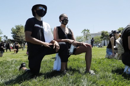 Golden State Warriors player Stephen Curry (L) and his wife Ayesha (R) during a demonstration over the arrest in Minnesota of George Floyd, who later died in police custody, in Oakland, California, USA, 03 June 2020. A bystander's video posted online on 25 May, appeared to show George Floyd, 46, pleading with arresting officers that he couldn't breathe as an officer knelt on his neck. The unarmed black man later died in police custody. California protest in wake of George Floyd death in Minneapolis, Oakland, USA - 03 Jun 2020