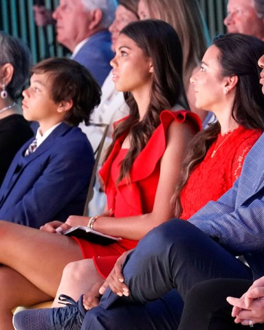 Tiger Woods sits with his family from left; his mother Kultida Woods, son Charlie Woods, daughter Sam Woods and his girlfriend Erica Herman during his induction into the World Golf Hall of Fame, in Ponte Vedra Beach, Fla
Hall of Fame Golf, Ponte Vedra Beach, United States - 09 Mar 2022