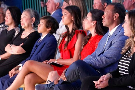 Tiger Woods is seated with his family from left to right;  his mother Kultida Woods, son Charlie Woods, daughter Sam Woods and girlfriend Erica Herman at his induction into the World Golf Hall of Fame, Ponte Vedra Beach, Fla Hall of Fame Golf, Ponte Vedra Beach, USA - March 09, 2022