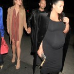 Kim Kardashian, Chrissy Teigen, John Legend & Kanye West dine out together as the pregnant beauties put their baby bumps on display.
