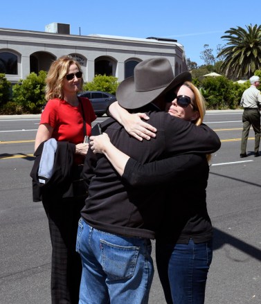 Jessica Parks, right, hugs Poway Mayor Steve Vaus outside of the Chabad of Poway Synagogue, in Poway, Calif. Several people were injured in a shooting at the synagogue
Synagogue Shooting-California, Poway, USA - 27 Apr 2019