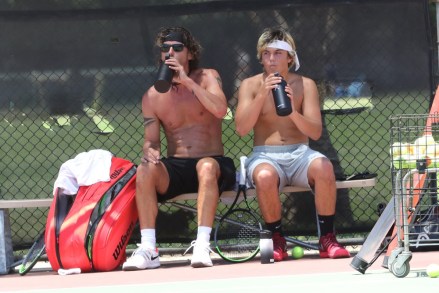 Los Angeles, CA  - *EXCLUSIVE*  - Gavin Rossdale and his son Kingston Rossdale seen shirtless playing tennis on a hot day in LA.  The two take a break together and get water before going at it again. Kingston helps gather balls before the duo put on their masks to leave the courts.Pictured: Gavin Rossdale, Kingston RossdaleBACKGRID USA 26 JUNE 2020 USA: +1 310 798 9111 / usasales@backgrid.comUK: +44 208 344 2007 / uksales@backgrid.com*UK Clients - Pictures Containing ChildrenPlease Pixelate Face Prior To Publication*