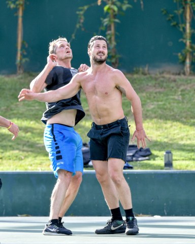 EXCLUSIVE: Maksim Chmerkovskiy playing a pick-up game of basketball in a park on Santa Monica Blvd. along with his brother, Val, who opted to ditch the shirt on the side line and to soak in the LA sunshine. The brothers are professional dancers, Maksym, known best for his work on Dancing With The Stars. The grace of their dancing carried over into their movements during the ball game. 05 Apr 2019 Pictured: Val Chmerkovski. Photo credit: PGEX/MEGA TheMegaAgency.com +1 888 505 6342 (Mega Agency TagID: MEGA395109_016.jpg) [Photo via Mega Agency]