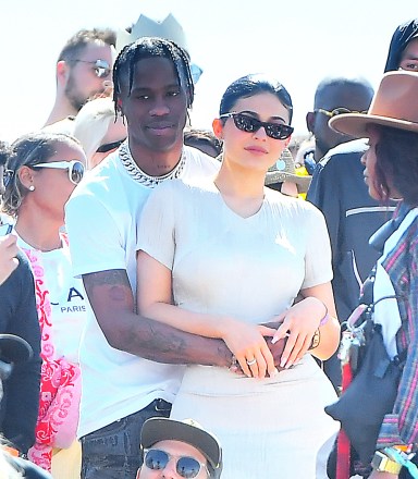 Travis Scott and Kylie Jenner show lots of PDA while hanging out with family and watching Kanye West perform his 'Church Sunday Services' at Coachella in Indio, CA. 21 Apr 2019 Pictured: Travis Scott and Kylie Jenner show lots of PDA while hanging out with family and watching Kanye West perform his 'Church Sunday Services' at Coachella in Indio, CA. Photo credit: Marksman / MEGA TheMegaAgency.com +1 888 505 6342 (Mega Agency TagID: MEGA403728_002.jpg) [Photo via Mega Agency]