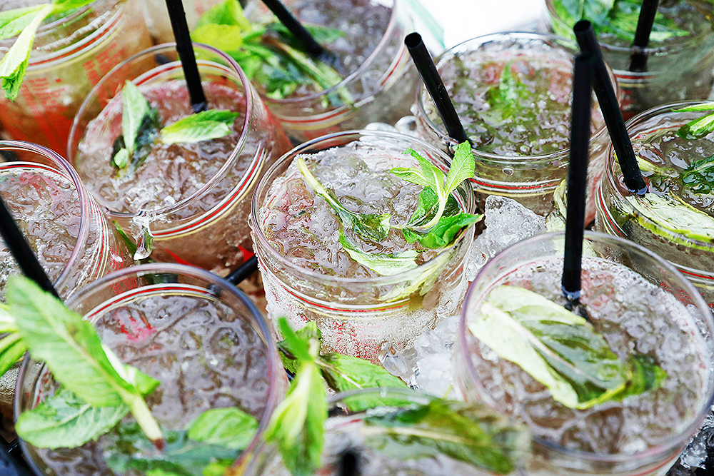 A vendor carries a tray Mint Julep glasses before the 144th running of the Kentucky Derby horse race at Churchill Downs, in Louisville, Ky
Kentucky Derby Horse Racing, Louisville, USA - 05 May 2018