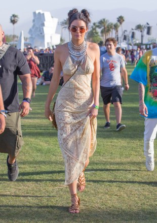 Kendal Jeener Arrive to the Coachella Music Festival in a stunning Beige Lace Dress in Indio CaliforniaPictured: Kendall Jenner arrives to CoachellaRef: SPL1265284 150416 NON-EXCLUSIVEPicture by: SplashNews.comSplash News and PicturesLos Angeles: 310-821-2666New York: 212-619-2666London: 0207 644 7656Milan: 02 4399 8577photodesk@splashnews.comWorld Rights