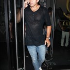 Professional basketball player Kris Humphries leaves Catch restaurant with a female companion