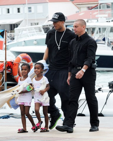 Kim Porter and her children arrive into Gustavia from their massive yacht to head to St Jean Beach. The Diddy family all posed and waved as they arrived into harbor on their dinghy boat. Kim was dressed in a very colorful Moo-Moo Dress. Kim Porter was with sons Quincy and Christian and her twin daughters Lila Star and Jessie James Combs.Pictured: Kim Porter with children Quincy,Christian and twins Lila Star and Jessie James Combs.,Kim Porter with children QuincyChristiantwins Lila StarJessie James Combs.Ref: SPL237026 301210 NON-EXCLUSIVEPicture by: SplashNews.comSplash News and PicturesLos Angeles: 310-821-2666New York: 212-619-2666London: 0207 644 7656Milan: 02 4399 8577photodesk@splashnews.comWorld Rights