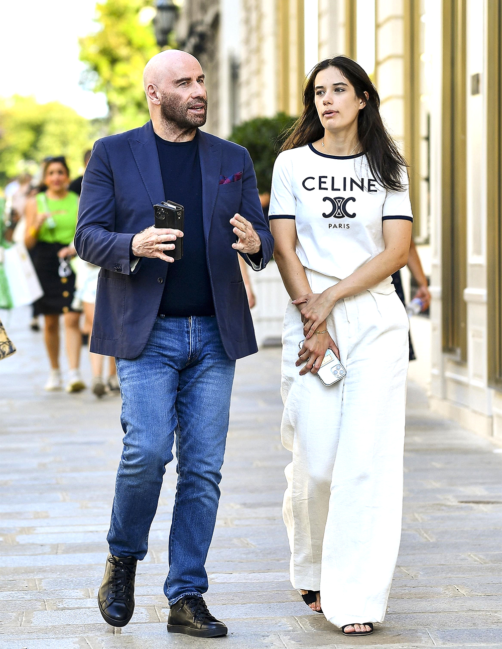 Paris, FRANCE - *EXCLUSIVE* - Actor John Travolta and his daughter Ella Bleue Travolta go shopping on avenue Montaigne.