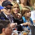 Charlie Sheen, ex-wife Denise Richards and their two daughters promote Charlie's new television series Anger Managemen at a baseball game between the New York Yankees and New York Mets