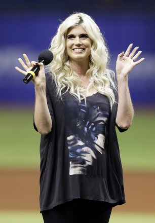 Recording artist Julianna Zobrist, wife of Kansas City Royals' Ben Zobrist, waves after singing the National Anthem before a baseball game between the Tampa Bay Rays and the Royals, in St. Petersburg, Fla
Royals Rays Baseball, St. Petersburg, USA
