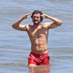 *EXCLUSIVE* Orlando Bloom, 45  shows off his VERY ripped abs at the beach