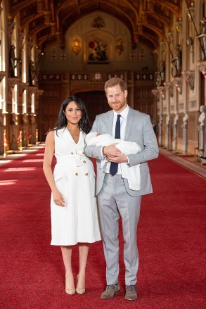 Prince Harry and Meghan Duchess of Sussex with their baby son during a photocall in St George's Hall at Windsor Castle in BerkshirePrince Harry and Meghan Duchess of Sussex new Baby Photocall, Windsor Castle, UK - 08 May 2019
