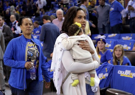 Ayesha Curry, right, wife of Golden State Warriors' Stephen Curry, holds daughter Ryan as they arrive at the NBA basketball game against the New Orleans Pelicans Tuesday, Oct. 27, 2015, in Oakland, Calif. (AP Photo/Ben Margot)