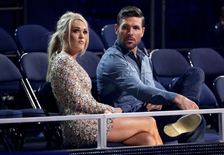 Carrie Underwood, left, and Mike Fisher appear in the audience at the CMT Music Awards on Wednesday, June 5, 2019, at the Bridgestone Arena in Nashville, Tenn. (AP Photo/Mark Humphrey)