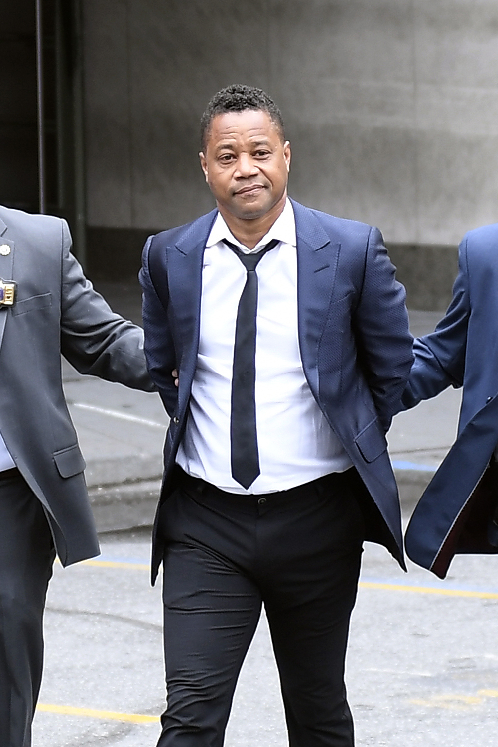 Cuba Gooding Jr leaves in handcuffs after turning himself to the police accussed of groping a woman in a bar in New York City