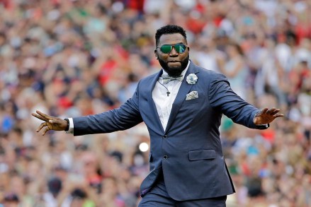 Boston Red Sox baseball great David Ortiz waves to fans, at Fenway Park in Boston as the team retires his number "34" worn when he led the franchise to three World Series titles. It is the 11th number retired by the Red Sox
Red Sox Ortiz Ceremony Baseball, Boston, USA - 23 Jun 2017