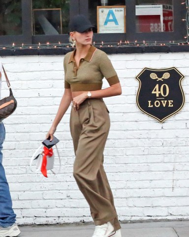 EXCLUSIVE: Hailey Baldwin is seen wearing a hat with the words OFF LIMITS on the side.Hailey was watching The NBA finals game 4 with a friend at 40 Love bar in West Hollywood. Justin was not with her as he was at the studio. 08 Jun 2019 Pictured: Hailey Bieber. Photo credit: Rachpoot/MEGA TheMegaAgency.com +1 888 505 6342 (Mega Agency TagID: MEGA439602_005.jpg) [Photo via Mega Agency]