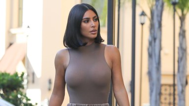 Kim Kardashian wears skintight bodysuit and mask at awards with