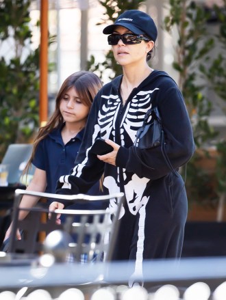 Calabasas, Calif. - *EXCLUSIVE* - Kourtney Kardashian looks like 'death' in a skull jumper she shares with daughter Penelope Disick from Sunlife Organics in Calabasas bought a healthy smoothie. Pictured: Kourtney Kardashian, Penelope Disick BACKGRID USA 16 May 2022 MUST READ MUST READ: IXOLA / BACKGRID USA: +1 310 798 9111 / usasales@backgrid.com UK: +44 208 344 2007 / uksales@backgrid.com *UK customers - image contains children please have faces pixelated before publication*