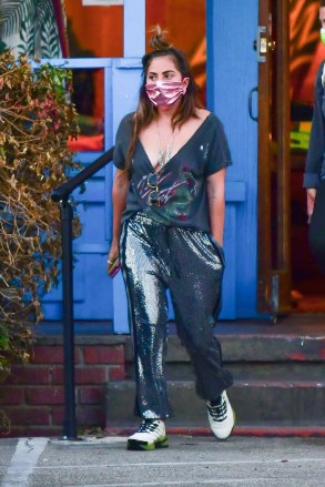 Malibu, CA  - *EXCLUSIVE* Lady Gaga goes shopping with a friend at Aviator Nation in Malibu on Tuesday. The singer stepped out in a pair of Iridescent pants and loose low cut top.Pictured: Lady GagaBACKGRID USA 26 MAY 2021 USA: +1 310 798 9111 / usasales@backgrid.comUK: +44 208 344 2007 / uksales@backgrid.com*UK Clients - Pictures Containing ChildrenPlease Pixelate Face Prior To Publication*