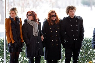 Priscilla Presley, Lisa Marie Presley, Benjamin Keough, Riley Keough Priscilla Presley, second from left, her daughter, Lisa Marie, second from right, and Lisa Marie's children, Riley Keough, 21, left, and Benjamin Keough, 18, right, take part in a ceremony commemorating Elvis Presley's 75th birthday on in Memphis, Tenn
Elvis At 75, Memphis, USA