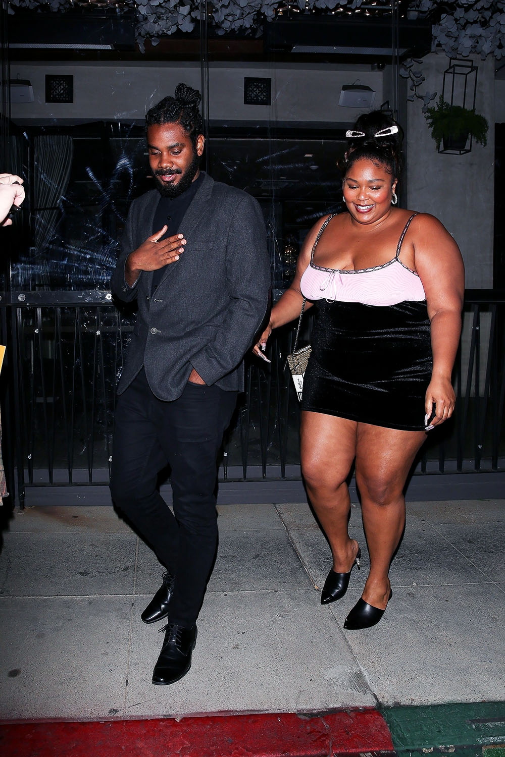 *EXCLUSIVE* Lizzo looks smitten on a night out with very handsome mystery man at Crustacean in Beverly Hills