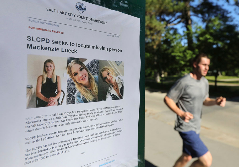 A jogger runs pass a poster of Mackenzie Lueck at Liberty Park in Salt Lake City. One person was taken into custody Friday, June 28, in connection with the disappearance of Lueck, a Utah college student who disappeared 11 days ago
Missing Student Utah, Salt Lake City, USA - 24 Jun 2019