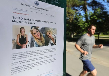 A jogger runs pass a poster of Mackenzie Lueck at Liberty Park in Salt Lake City. One person was taken into custody Friday, June 28, in connection with the disappearance of Lueck, a Utah college student who disappeared 11 days ago
Missing Student Utah, Salt Lake City, USA - 24 Jun 2019