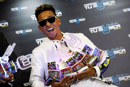 Puerto Rican singer Ozuna poses with several of his awards including 'Artist of the Year' and 'Album of the Year' during the ceremony of the Tu Musica Urbano Awards in San Juan, Puerto Rico, 21 March 2019. Ozuna dominates the nominations with 19 awards and Daddy Yankee is recognized for his 25 year career as a leader of the musical movement.
Tu Musica Urbano Awards, San Juan, Puerto Rico - 21 Mar 2019