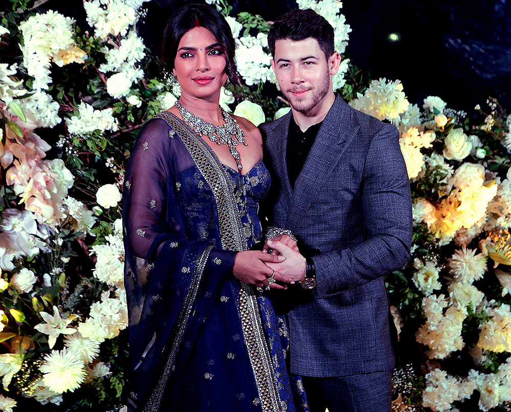 Bollywood actress Priyanka Chopra and musician Nick Jonas stand for photographs at their wedding reception in Mumbai, India
Chopra Jonas Wedding, Mumbai, India - 19 Dec 2018