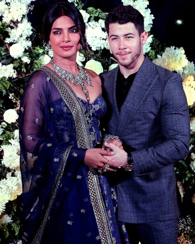Bollywood actress Priyanka Chopra and musician Nick Jonas stand for photographs at their wedding reception in Mumbai, India
Chopra Jonas Wedding, Mumbai, India - 19 Dec 2018