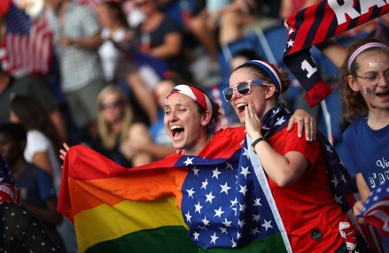 Fans for the U.S. hold up yell as they hold up a rainbow flag prior to the Women's World Cup quarterfinal soccer match between France and the United States at the Parc des Princes, in ParisUS WWCup Soccer, Paris, France - 28 Jun 2019