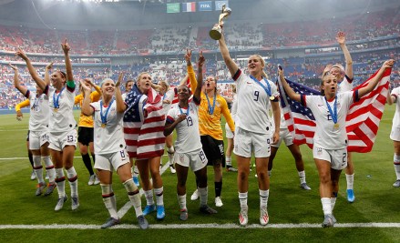 United States' players jump to celebrate with the trophy after winning the Women's World Cup final soccer match between US and The Netherlands at the Stade de Lyon in Decines, outside Lyon, France
US Netherlands WWCup Soccer, Decines, France - 07 Jul 2019