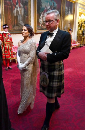 Stephanie Grisham and Secretary of State for Environment, Food and Rural Affairs, Michael Gove arrive through the East Gallery during the State Banquet at Buckingham Palace, London, on day one of the US President's three day state visit to the UK
US President Donald Trump state visit to London, UK - 03 Jun 2019