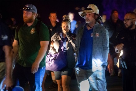 Police officers escort people from Christmas Hill Park following a deadly shooting during the Gilroy Garlic Festival, in Gilroy, Calif., on
California Festival Shooting, Gilroy, USA - 28 Jul 2019