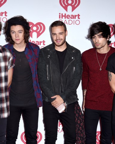 LAS VEGAS, NV - SEPTEMBER 20:  (L-R) Niall Horan, Harry Styles, Liam Payne, Zayn Malik and Louis Tomlinson of One Direction pose in the press room during the 2014 iHeartRadio Music Festival at MGM Grand Garden Arena on September 20, 2014 in Las Vegas, Nevada.  (Photo by Steve Granitz/WireImage)