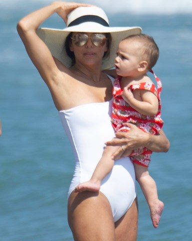 Eva Longoria takes the opportunity to take a walk with her son on the beach and take photos ***SPECIAL INSTRUCTIONS*** Please pixelate children's faces before publication.***. 09 Jul 2019 Pictured: EVA LONGORIA WITH HER SON. Photo credit: MEGA TheMegaAgency.com +1 888 505 6342 (Mega Agency TagID: MEGA462204_004.jpg) [Photo via Mega Agency]