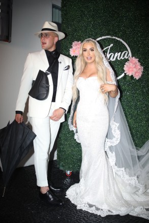 Jake Paul and Tana Mongeau’s giant wedding extravaganza at the infamous Graffiti Mansion in Las Vegas. The YouTuber’s met in late April, then right after the two got engaged at Mongeau's 21st birthday party making it announced at the video convention VidCon. Paul gifted her with a $124,000 Mercedes G Wagon and the ring the diamond-encrusted ring the couple got engaged with is fake and it reportedly retails for $125. Their ceremony was held at the Graffiti Mansion, that often gets spray painted to promote things like the ever popular brand “Supreme”. The event, as well as the after party held at a separate location called the “Sugar Factory”, was filmed by MTV and aired for YouTube. 28 Jul 2019 Pictured: Jake Paul Tana Mongeau. Photo credit: APEX / MEGA TheMegaAgency.com +1 888 505 6342 (Mega Agency TagID: MEGA474814_009.jpg) [Photo via Mega Agency]