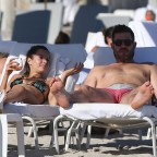 EXCLUSIVE: Canadian sports commentator Jesse Palmer and Brazilian model Emely Fardo drink rose wine and show PDA on the beach in Miami