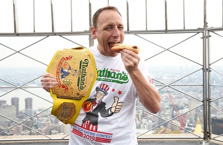 Eleven-time and defending men's champion Joey Chestnut poses on the 86th floor observation deck during the Nathan's Famous international Fourth of July hot dog eating contest weigh-in at the Empire State Building, in New York
2019 Nathan's Hot Dog Eating Contest Weigh-In, New York, USA - 03 Jul 2019