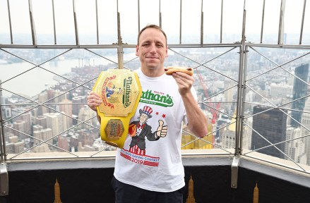 Eleven-time and defending men's champion Joey Chestnut poses on the 86th floor observation deck during the Nathan's Famous international Fourth of July hot dog eating contest weigh-in at the Empire State Building, in New York
2019 Nathan's Hot Dog Eating Contest Weigh-In, New York, USA - 03 Jul 2019