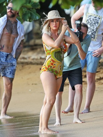 Katy Perry shoots a music video with a heavily-tattooed male mode in a yellow one-piece swim suit in Hawaii.Pictured: Katy PerryRef: SPL5101653 020719 NON-EXCLUSIVEPicture by: SplashNews.comSplash News and PicturesLos Angeles: 310-821-2666New York: 212-619-2666London: 0207 644 7656Milan: 02 4399 8577photodesk@splashnews.comWorld Rights