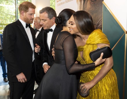 Britain's Prince Harry, Duke of Sussex (L) chats with Disney CEO Robert Iger as Britain's Meghan, Meghan Duchess of Sussex (2nd R) embraces US singer-songwriter Beyonce Knowles (R) as they attend the European premiere of the film The Lion King.
'The Lion King' film premiere, London, UK - 14 Jul 2019