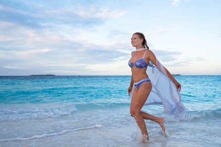 MODEL RELEASED Young woman in bikini running on beach at dusk, Fuvahmulah Island, Indian Ocean, Maldives
VARIOUS