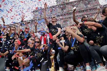 The U.S. women's soccer team, Megan Rapinoe center, celebrates at City Hall after a ticker tape parade, in New York. The U.S. national team beat the Netherlands 2-0 to capture a record fourth Women's World Cup title
WWCup US Returns Home Soccer, New York, USA - 10 Jul 2019