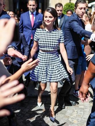 Paris, FRANCE - *EXCLUSIVE* - Singer, actress and producer Selena Gomez is all smiles as she leaves the Hotel de Crillon in Paris.  Selena wears a black and white checkered crop top with a matching skirt and white heels.  Pictured: Selena Gomez BACKGRID USA JULY 8, 2022 BYLINE MUST READ: Best Picture / BACKGRID USA: +1 310 798 9111 / usasales@backgrid.com UK: +44 208 344 2007 / uksales@backgrid.com *UK Clients - Images containing children Please rasterize face before posting*