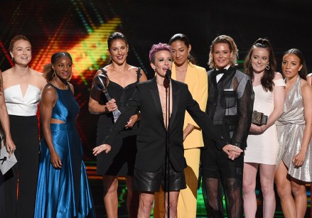Megan Rapinoe, center, and members of the U.S. women's national soccer team accept the award for best team at the ESPY Awards, at the Microsoft Theater in Los Angeles
2019 ESPY Awards - Show, Los Angeles, USA - 10 Jul 2019